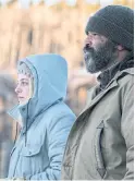  ??  ?? Riley Keough and Jeffrey Wright star in the mesmerizin­g film, Hold the Dark.