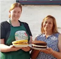  ??  ?? Emily Turner, from Home Baking Cheshire, and Hilary Spokes, licensee of the Hanging Gate