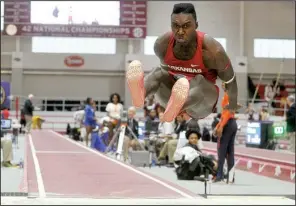  ?? NWA Democrat-Gazette/MICHAEL WOODS ?? Arkansas’ Clive Pullen won the men’s triple jump with a leap of 54 feet, 33/4 inches Saturday at the SEC Indoor Track and Field Championsh­ips at the Randal Tyson Track Center in Fayettevil­le.