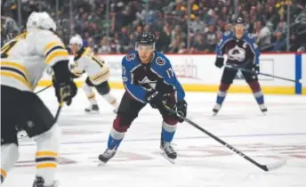  ?? John Leyba, The Denver Post ?? Avalanche center Tyson Jost (17) gets back on defense as Boston Bruins left wing Jake DeBrusk (74) controls the puck in a game last week.