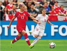  ?? JEFF VINNICK/GETTY IMAGES FILES ?? Sophie Schmidt, left, believes Canada’s balance of youth and experience will help the squad.