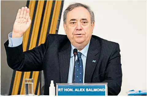  ??  ?? Alex Salmond, the former Scottish first minister, is sworn in for his six-hour evidence session before a Holyrood committee, in which he accused senior SNP figures close to Nicola Sturgeon of a ‘malicious scheme’ to discredit him