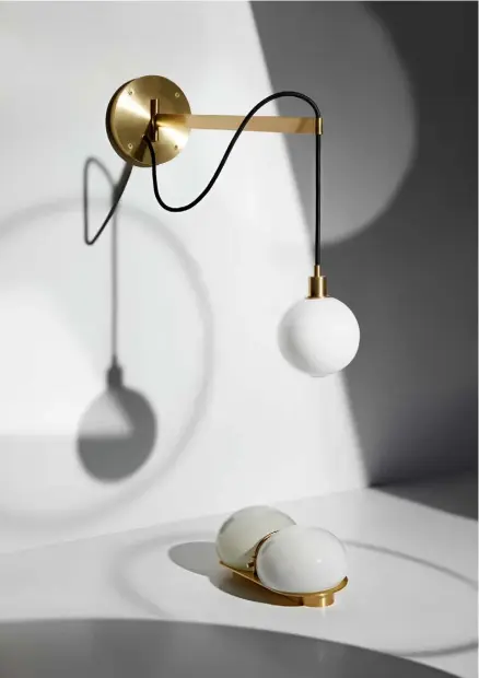  ??  ?? The Drape Arm 1 Sconce wall light, £895, and the Twin Sconce hand-blown glass diffuser, £1,080, both by SkLO
