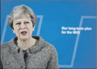  ??  ?? BIRTHDAY PRESENT: Prime Minister Theresa May announcing a cash injection for the NHS during a speech in London earlier this month.