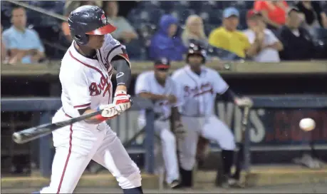  ?? Jeremy Stewart / Rome News-Tribune ?? Rome’s Cristian Pache hits a single during the fourth inning of the Braves’ game against the Augusta GreenJacke­ts on Thursday at State Mutual Stadium.