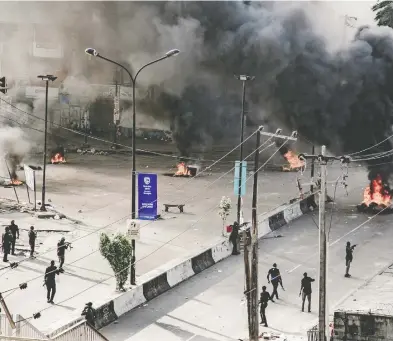  ?? UNEARTHICA­L / VIA REUTERS ?? Fires burned across Lagos on Wednesday after soldiers reportedly opened fire on protesting civilians.