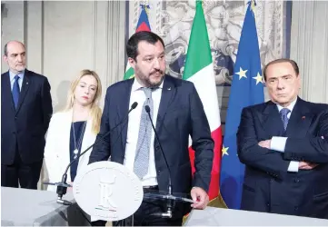  ?? — Reuters photo ?? Salvini (centre) speaks next to president of Fratelli d’Italia party (Brothers of Italy) Giorgia Meloni (left) and Berlusconi following a talk with Mattarella at the Quirinale palace in Rome.