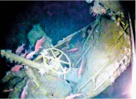  ?? AUSTRALIAN DEPARTMENT OF DEFENSE VIA AP ?? In this undated image provided by the Australian Department of Defense, fish swim around the helm of the Australian submarine HMAS AE1 off the coast of the Papua New Guinea island of New Britain. One of Australia’s oldest naval mysteries has been...