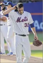  ?? Julie Jacobson / Associated Press ?? Mets starter Steven Matz walks off the field during the seventh inning. He gave up one run in 61⁄3 innings.