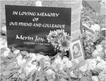  ?? JOE CAVARETTA/SOUTH FLORIDA SUN SENTINEL ?? A memorial for slain nurse Merin Joy stands in the employee parking lot at Broward Health Coral Springs.