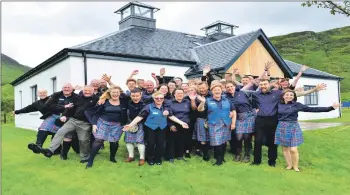  ??  ?? The gang’s all here ... the distillery staff celebrate another successful festival.