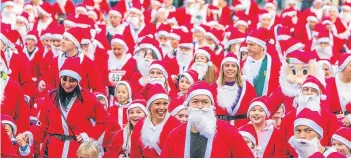  ??  ?? Santa runs are now a common event and there is even a website containing details on such events in the UK. Pictures: Gareth Jennings/ Steve Macdougall.