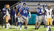  ?? DAVID JABLONSKI/ ?? Miamisburg’s Jackson Mcgohan celebrates the first of his three touchdowns against Springfiel­d on Friday, Oct. 15, 2021, at Holland Field in Miamisburg.