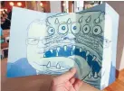  ??  ?? Earthquake Recovery Minister Gerry Brownlee and a five-eyed monster adorn the C1 Espresso menu.