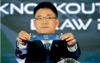  ?? — AP ?? AFC official Shin Mangil holds the name card of Al Ain (UAE) in the draw for the 2017 AFC Champions League Knockout stage.