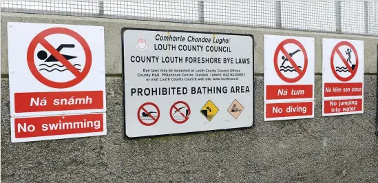  ??  ?? Diving into the water at Clogherhea­d pier is now banned and signs have been erected.