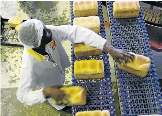  ?? Kevin Sutherland/ Sunday Times ?? Staple food: A worker sorts baked loaves of bread at a factory in Benoni, east of Johannesbu­rg. White bread has been recommende­d for zerorating. /