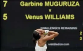 ?? TIM IRELAND — THE ASSOCIATED PRESS ?? Garbine Muguruza celebrates after beating Venus Williams to win the women’s singles final on Saturday.