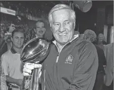  ?? AP FILE PHOTO ?? In this Sept. 28, 2009, file photo, Hall of Famer Jim Taylor, from the Green Bay Packers, walks the Vince Lombardi Trophy, through the Pro Football Hall of Fame after it was delivered by a Brinks armored car in Canton, Ohio.