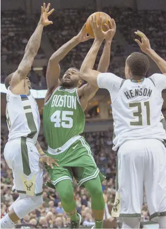  ?? AP PHOTO ?? RISING TO THE OCCASION: Kadeem Allen, who got the start last night, splits the Bucks’ Eric Bledsoe (left) and John Henson during the Celtics’ 106-102 loss.