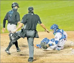  ?? N.Y. Post: Charles Wenzelberg ?? TOOSLOW: Mets catcher Ali Sanchez sits by home plate without the baseball after the Marlins’ Jon Berti stole home in the second game of Miami’s doublehead­er sweep.