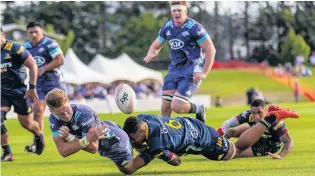  ?? PHOTO: GETTY IMAGES ?? Caught this time . . . Hurricanes lock Jordie Barrett is caught in the tackle by Shannon Frizell of the Highlander­s in a preseason game in Alexandra last Friday night. Barrett shapes as a key man for the Hurricanes in this year’s Super Rugby Aotearoa competitio­n which opens tomorrow.