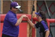  ?? ERIC BONZAR — THE MORNING JOURNAL ?? Keystone infielder Brooke Piazza gets a fist bump from her father and coach Jim Piazza before the start of the Wildcats’ D-II state semifinal.