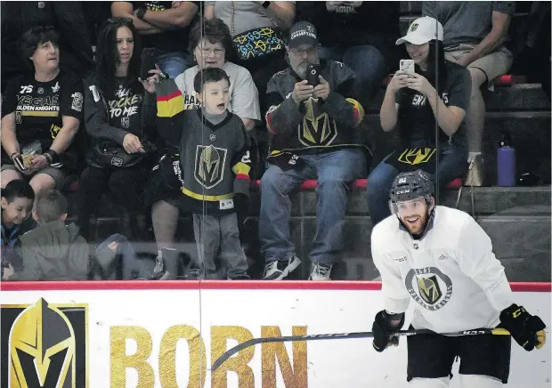  ?? — GETTY IMAGES FILES ?? Fans watch Jonathan Marchessau­lt during a Las Vegas Golden Knights practice. Having a state-of-the-art practice facility open to the public is becoming a critical feature of an NHL franchise’s marketing strategy.