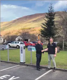  ?? ?? Lochranza manager Stewart Bowman shakes hands with Johnny at the charging points installed at Lochranza Distillery.