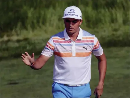  ?? DAVID J. PHILLIP — THE ASSOCIATED PRESS ?? Rickie Fowler reacts after his birdie on the 12th hole during the first round of the U.S. Open on Thursday.