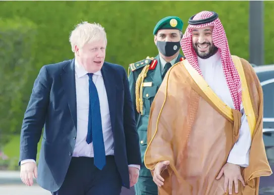  ?? (Saudi Royal Court/Reuters) ?? BRITISH PRIME MINISTER Boris Johnson is welcomed to Riyadh by Saudi Crown Prince Mohammed bin Salman last month. MBS must be aware that the Palestinia­n Authority’s advocacy of the two-state solution is not its real objective.