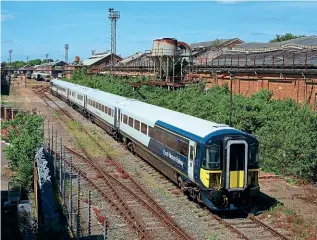  ?? JAMIE SQUIBBS ?? The demise of SWR’s Class 442s in favour of more commuter stock may prove to be a premature decision in the post-Covid world. Nos. 442403 and 442409 are pictured at Wolverton Works on June 14 after arriving from Bournemout­h depot for scrapping.