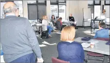  ?? ADAM MACINNIS/THE NEWS ?? Margie Grant-Walsh, executive director of Big Brothers Big Sisters of Pictou County, speaks to a group involved in a new pilot project called Mentoring Plus at Glasgow Square.