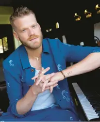  ?? CHRIS PIZZELLO/AP ?? A member of Pentatonix, Scott Hoying, seen July 28, has released his solo debut,“Parallel.”