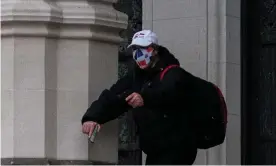  ?? Photograph: Jeenah Moon/ Reuters ?? The gunman outside Cathedral of Saint John the Divine was carrying two handguns, and a backpack containing gasoline, wire, tape, knives and a Bible.