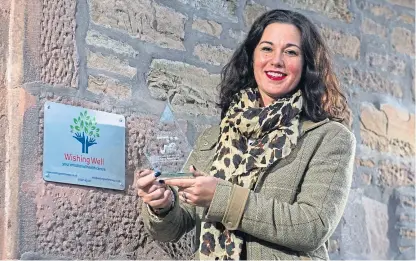  ??  ?? Lindsey-Anne Knox, of the Wishing Well Emotional Wellbeing Centre in Forfar, with her award.