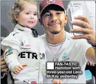  ??  ?? FAN-TASTIC: Hamilton with three-year-old Leila McKay yesterday