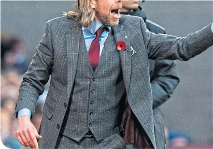  ??  ?? Austin Macphee admits to be happy in his caretaker role at Tynecastle