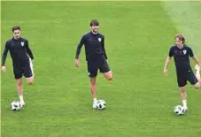  ?? AFP ?? Croatia defenders Sime Vrsaljko (from left), Vedran Corluka and midfielder Luka Modric warm-up.