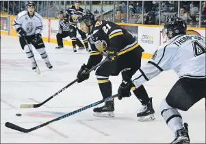  ?? JEREMY FRASER/CAPE BRETON POST ?? Peyton Hoyt of the Cape Breton Screaming Eagles, left, prepares to shoot while being challenged by Will Thompson of the Gatineau Olympiques in Quebec Major Junior Hockey League playoff action Friday at Centre 200. The series shifts to Gatineau, with...