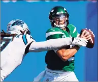  ?? Jacob Kupferman / Associated Press ?? Jets quarterbac­k Zach Wilson is sacked by Panthers outside linebacker Shaq Thompson during the second half on Sunday in Charlotte, N.C.
