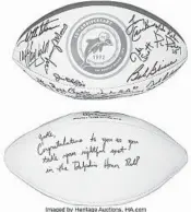  ?? AUCTIONS /COURTESY
HERITAGE ?? 1972 Miami Dolphins team-signed reunion football and Stephen Ross-signed football to Jake Scott.