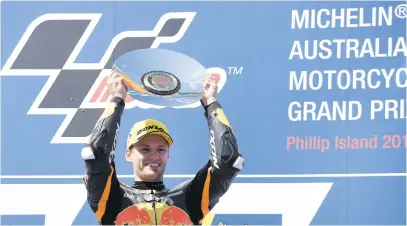  ?? Picture: AFP ?? LOCAL IS LEKKER. South Africa’s Brad Binder celebrates with his trophy after winning the Australian Grand Prix Moto2 race at Phillip Island yesterday.