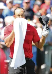  ?? STEPHEN M. DOWELL/ORLANDO SENTINEL ?? Tiger Woods heads into the Masters this week with his career seemingly on an upswing, but experts say he’ll need to win and stay healthy to build his brand back to where it once was.