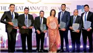  ??  ?? Allianz Insurance Lanka Limited Managing Director Surekha Alles with company’s six Great Manager Award winners