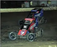  ?? RICH KEPNER - FOR MEDIANEWS GROUP ?? Chris Windom, rear, makes a last-lap pass of Tyler Courtney (7) to win the Ken Brenn USAC Midget Masters race during Thunder on the Hill racing at Grandview on July 30.