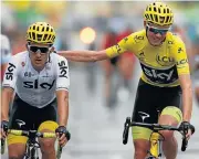 ?? /Reuters ?? Done and dusted: Tour de France winner Chris Froome, right, gives teammate Michal Kwiatkowsk­i a pat on the back as they cross the line in Paris on Sunday.