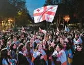  ?? VANO SHLAMOV/GETTY-AFP ?? Georgians celebrate in Tbilisi on Dec. 15.