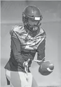  ??  ?? Arizona State quarterbac­k Manny Wilkins takes a snap during practice on Tuesday.