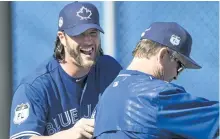  ?? NATHAN DENETTE/THE ?? Toronto reliever Jason Grilli, left, laughs with manager John Gibbons this week in Dunedin, Fla.